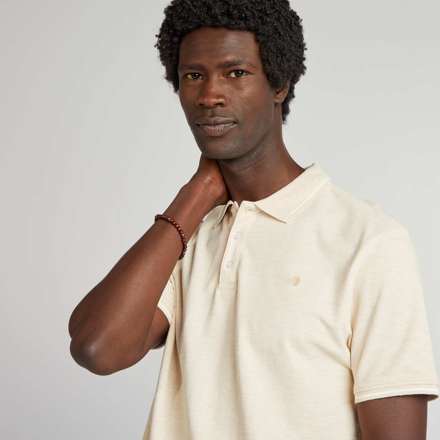 Polo en piqué de coton avec broderie poitrine Beige