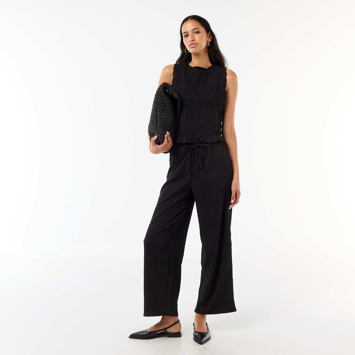 Pantalon large en maille smockée NOIR