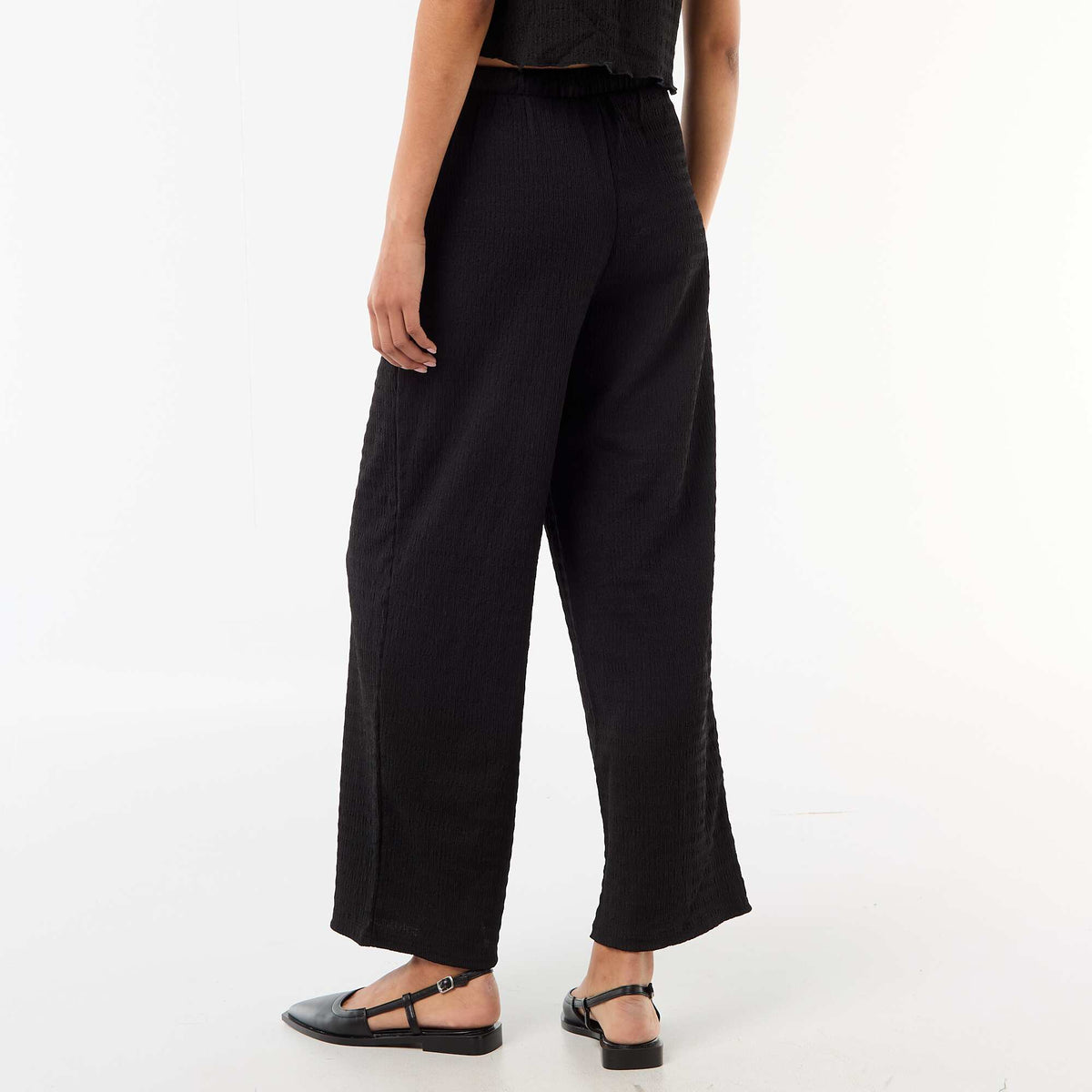Pantalon large en maille smockée NOIR