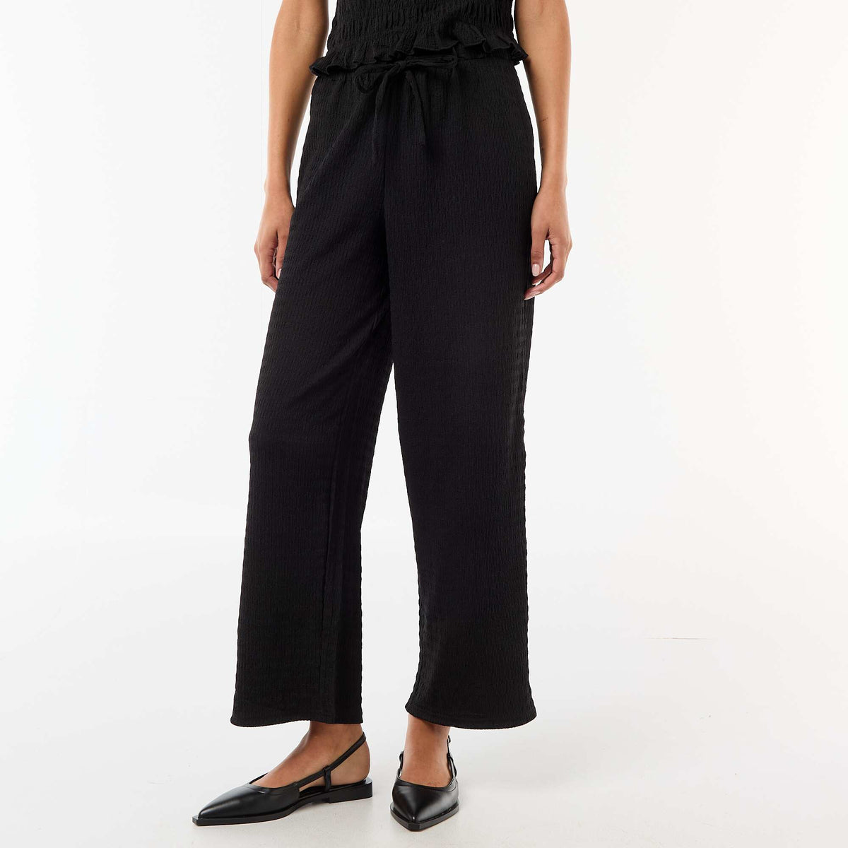 Pantalon large en maille smockée NOIR